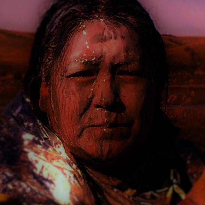 Maced Woman at Standing Rock         Original Image by Kelly Daniels, Modified by Kat Williams